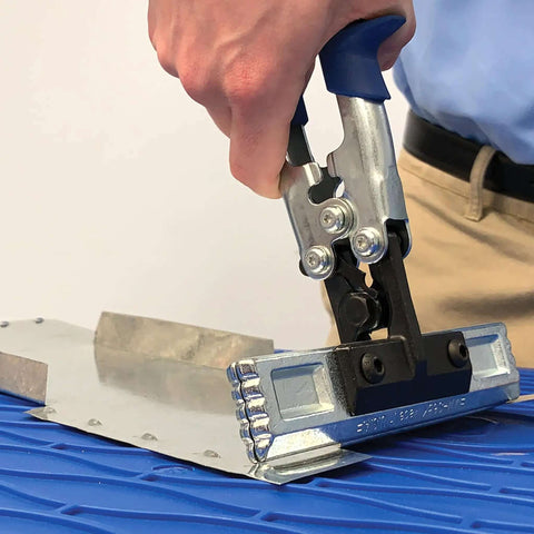 Person using Straight Sheet Metal Seamer Set with 3 in forged blade on metal sheet, interchangeable handles for versatile bending