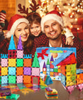 Family enjoying Magnetic Tiles Building Blocks For Kids Ages Three To Eight with colorful tile creations and holiday decor.