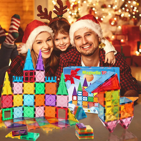 Family enjoying Magnetic Tiles Building Blocks For Kids Ages Three To Eight with colorful tile creations and holiday decor.
