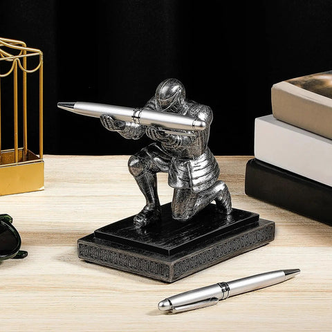 Knight Pen Holder With Two Pens And Resin Desk Organizer For Men placed on wooden desk near books and sunglasses.