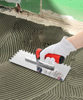 Hand using Three Piece Concrete Trowel Set With Stainless Steel Square Notched And Flat Finishing Trowels for tile cement work