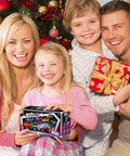 Family holding Pink 1:20 Scale RC Truck With DIY Stickers And Doll in a festive setting, children smiling with gifts.