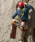 Climber with Arborist Speedline Kit 26 Inch 6 Pack Pro Grade With 29kN 1 Inch Webbing And 35kN Double Action Snap Hook on rock face