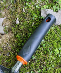 Close-up of heat-resistant handle on lightweight fireplace shovel 12.6 inch ash shovel for fire pit and backyard carbon steel tool.