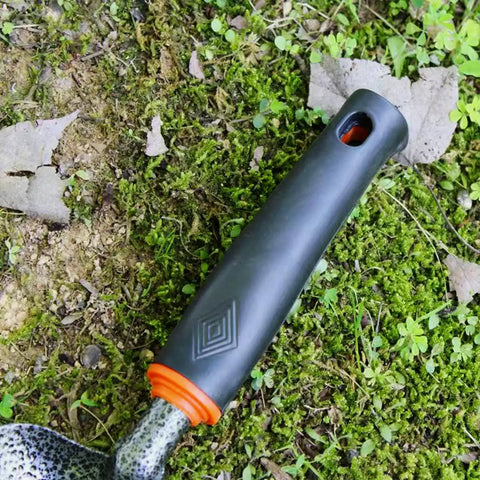 Close-up of heat-resistant handle on lightweight fireplace shovel 12.6 inch ash shovel for fire pit and backyard carbon steel tool.