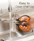 Heavy Duty Kitchen Scissors Three Pack Set being washed under a faucet, featuring stainless steel blades and orange handles