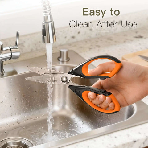 Heavy Duty Kitchen Scissors Three Pack Set being washed under a faucet, featuring stainless steel blades and orange handles