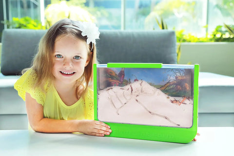 Girl smiling next to Large Viewing Ant Farm for Live Ants, Hands On STEM Toy, DIY Science Kit, Educational Nature Learning Activity, Green