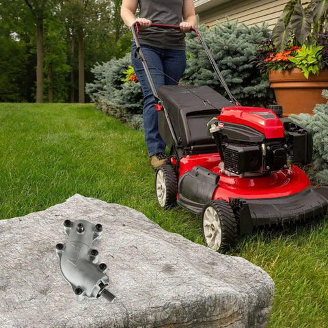 Beefy Gearbox Assembly for 4-Cycle String Trimmer - Replacement Part 753-08122 on rock, shown with red lawn mower nearby
