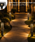 Modern Black LED Pathway Lights Sleek Cone Bollards illuminate a garden path with warm 3000K glow for outdoor use.