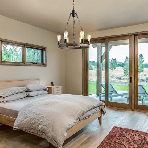 Farmhouse Wagon Wheel Chandelier With Rustic Openwork Round Metal Frame And Natural Rope, 6 Light Fixture in cozy bedroom