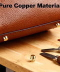 Top Shelf Solid Brass Nailhead Studs With A Killer Gold Shine Featuring No Fuss Flat Head Screw Back Rivets Made For Heavy Duty Leather Handbag Fixes And Smooth Diy Craft Projects That Truly Deliver on a brown leather bag with tools.