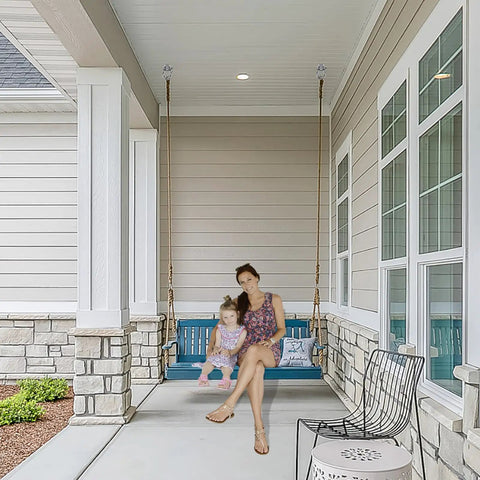 Bulletproof Heavy Duty Swing Hangers 4 Pack supporting a woman and child on a porch swing in a residential setting.