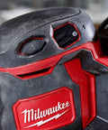 Close-up of Slick Cordless Random Orbit Sander Kit With M18 Battery Pack showing control buttons and battery indicator.