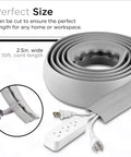 Rolled 10ft gray floor cord cover with power strip, showing cutting detail, labeled as 2.5in wide