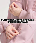 Close-up of pink Zip Up Hoodie With Built In Eye Mask And Multi Pockets For Travel Unisex Fleece Sweatshirt showing cuff pocket detail.