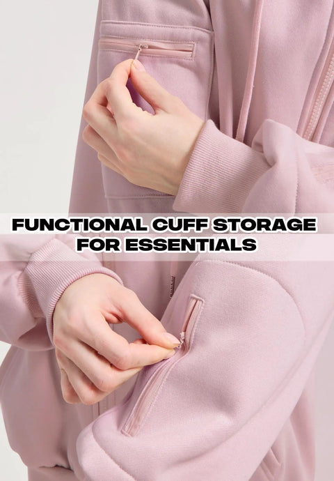 Close-up of pink Zip Up Hoodie With Built In Eye Mask And Multi Pockets For Travel Unisex Fleece Sweatshirt showing cuff pocket detail.