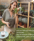 Handy 3.5 Inch Electric Herb Grinder With Brush And Scoop Cordless Usb Rechargeable Food Chopper For Spices Garlic Bpa Free Stainless Steel Blades in kitchen with fresh herbs.