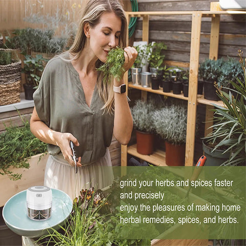 Handy 3.5 Inch Electric Herb Grinder With Brush And Scoop Cordless Usb Rechargeable Food Chopper For Spices Garlic Bpa Free Stainless Steel Blades in kitchen with fresh herbs.