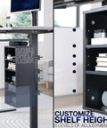 Side view of black clamp-on under desk shelving unit for office supplies, showcasing adjustable shelf height with devices and supplies.