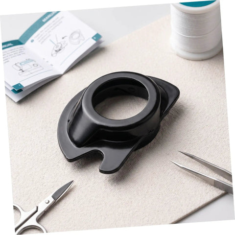 3 Pack Top Loading Dropin Bobbin Case For Sewing Machines Plastic Spare Part With Smooth Ergonomic Design For Stable Threading And Easy Replacement Must Have Go To Crafting Accessory black top-loading bobbin case on sewing workspace