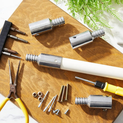 6 Piece Threaded Tip Replacement Kit For Extension Poles And Metal Brooms, DIY Friendly, Includes Nuts, Short And Long Screws, Blind Rivets, And 1 Inch Broom Handle Adapter Tips. Metal threaded tips and fasteners laid out on board