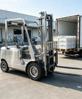 Badass Low Noise Electric Forklift Heavy Duty Pallet Lifter Truck For Warehouse Logistics and Compact Dock Loading Cargo Hauling With One To Three Ton Range For No Sweat Pallet Work, with chrome-like body and large tires.