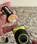 Applying All-In-One 5oz Synthetic Ester Lubricant Spray With Precision Needle to a razor blade for precise lubrication