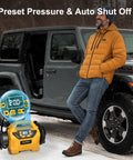 Man using Cordless Tire Inflator Deflator With 160 PSI High Pressure Digital Gauge Auto Shut Off LED Light in winter