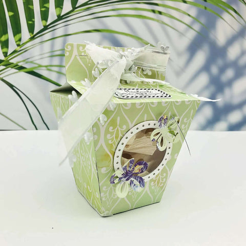 Decorative gift box crafted with Milk Box Gift Box Die Cut Set For Paper Craft And Scrapbooking, adorned with ribbons and butterflies.