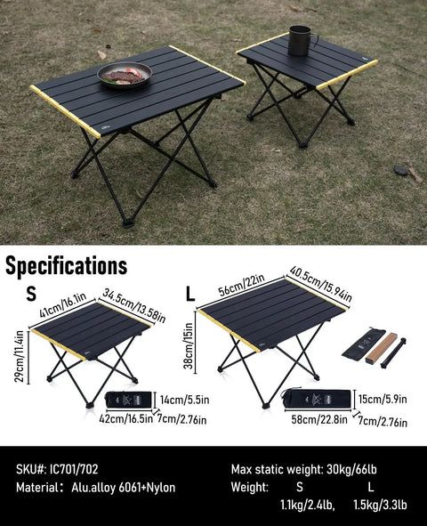 Small black ultralight camping folding table with carry bag, aerospace-grade aluminum, on grass, supports up to 66 lbs