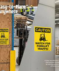 Built Like A Tank Heavy Duty Caution Watch For Forklift Traffic Safety Sign Rust Resistant Outdoor Aluminum Warning Plaque Easy Screw Mounting displayed in a warehouse setting.