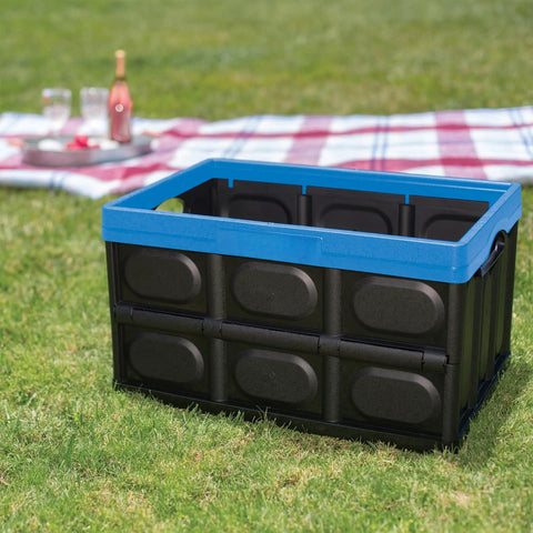 Heavy Duty Collapsible Storage Bin With 12 Gallon Capacity And Built In File Organizer Rails For Home Office Garage Car Trunk Folding Plastic Tote With Easy Grip Handles Black Blue on grass outdoors.