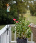 Deck Torch Mounting Bracket Kit With Four Adjustable Clamps For Rails Or Balusters, Fits Torch Poles 0.75 To 1.25 Inches, installed on a balcony