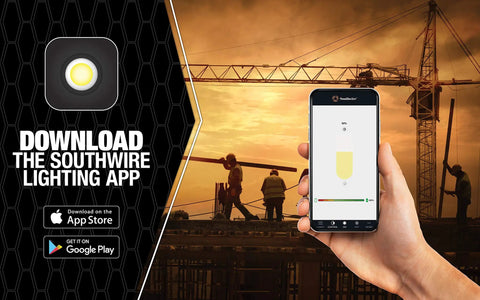 Hand holding smartphone with app for 2000 Lumen LED Rechargeable Work Light With USB Power Outlet at construction site.