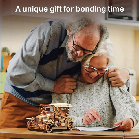 Elderly couple assembling a 3D Wooden Puzzle Car Kit For Adults And Teens One To Fifteen Scale Vintage 1910s Classic Car Model