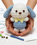 Beginner Crochet Amigurumi Kit For Puppy With Bow Tie, 5 Inch Starter Set, Video Tutorial Included, All Supplies Included, Easy Learn To Crochet, Great Gift For Women Teens Girls displayed with tools and materials
