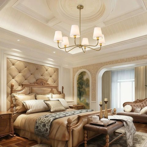 Smooth Operator 6 Light Brass Gold Chandelier With White Fabric Shades above an elegant bedroom setting with plush bedding.