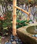 Epic 36 Inch Bamboo Fountain With Pump For In Ground Disappearing Water Features Outdoor Garden Waterfall next to stone basin