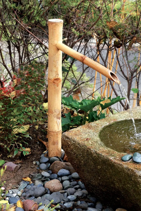 Epic 36 Inch Bamboo Fountain With Pump For In Ground Disappearing Water Features Outdoor Garden Waterfall next to stone basin