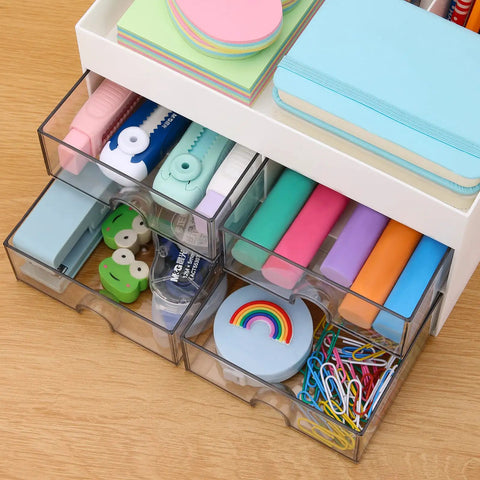 Desktop Organizer With Drawer And Multi Compartment Storage Box White filled with pens, sticky notes, paper clips, and accessories