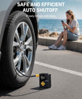 L7 Mini Tire Inflator Portable Air Compressor with LED light by car tire, woman seated nearby