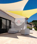 Beige 8x8 Foot Shade Sail Rectangle Canopy for patio offering sun block, set in a modern outdoor space with furniture and trees.
