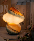 Pacifier Shaped Mushroom Lamp With Stepless Dimmable Glass Bedside Table Lamp, lit on a cozy nightstand setting.