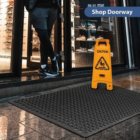 Anti Fatigue Drainage Rubber Mat For Wet Areas Non Slip Commercial Kitchen Floor Mat With Holes Rugged Natural Rubber Easy Clean Heavy Duty Black Pro Grade shown at store entrance.