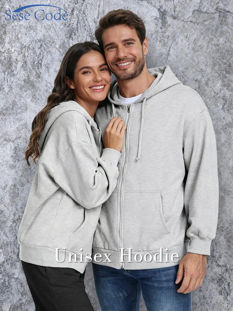 Couple wearing Unisex Travel Hoodie With Built In Eye Mask In Airplane Mode For Naps On The Fly Cozy Zip Up Fleece Jacket.