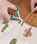 Sewing Scissors Bundle Set For Quick Cuts And Precise Sewing performing embroidery cutting on fabric with 3.9 Inch scissors.