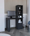 Boss Level Gaming Standing Desk With Smooth Hydraulic Lifts And Zero Sweat Interlocking Assembly For Rugged Modular Home Office Workstation Configuration in dark wood with monitor and shelves.