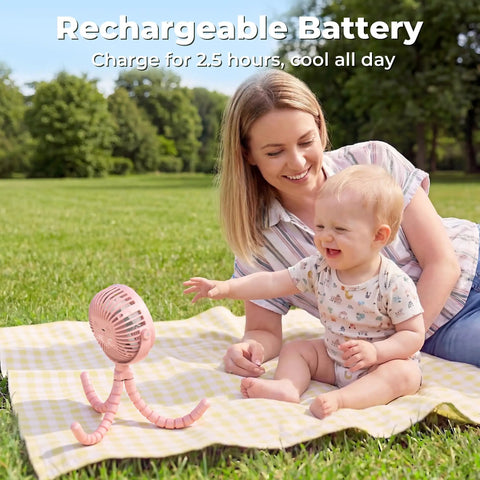 Battery Operated Stroller Fan With Flexible Tripod Clip On placed on picnic blanket next to mother and baby outdoors