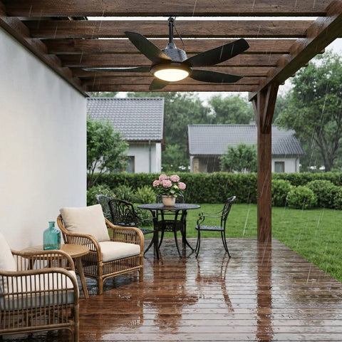 42 Inch Outdoor Ceiling Fan With Lights, IP65 Weatherproof, App And Remote Control, Dimmable 3CCT LED, 6 Speed Quiet DC Motor, Hanging Gazebo Fan Black, Plug In Ceiling Fan For Patios Porches And Backyard on wooden patio with chairs and table in the rain.